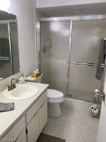 The Master bath has single sink vanity and walk-in shower.