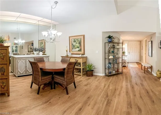 Dining space featuring light hardwood / wood-style flooring and a chandelier