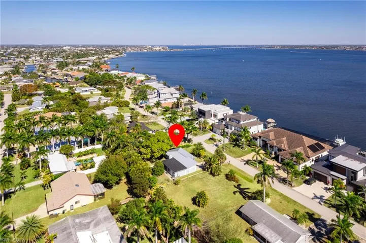 View of property location with nearby suburban area and a large body of water