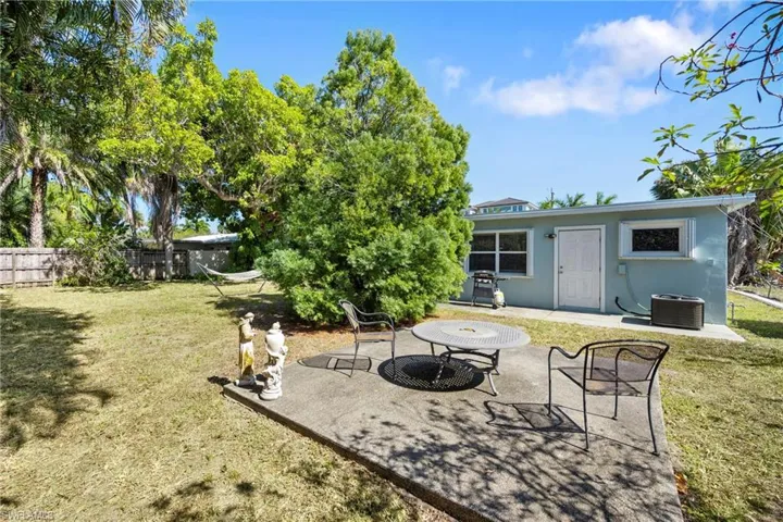 Rear view of property with a patio and stucco siding