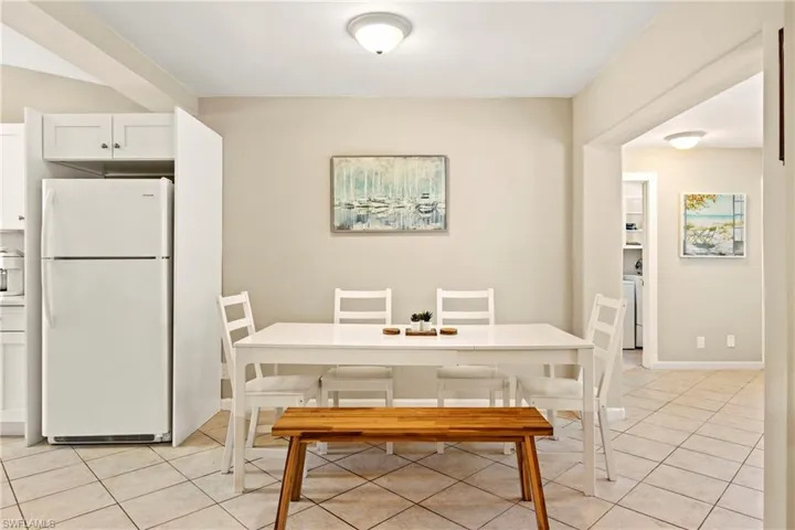 Dining space featuring light tile patterned flooring