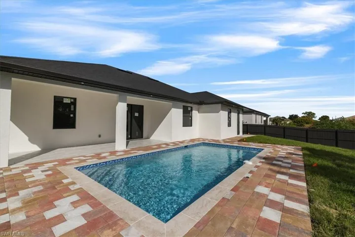 View of pool with a patio area and a fenced backyard