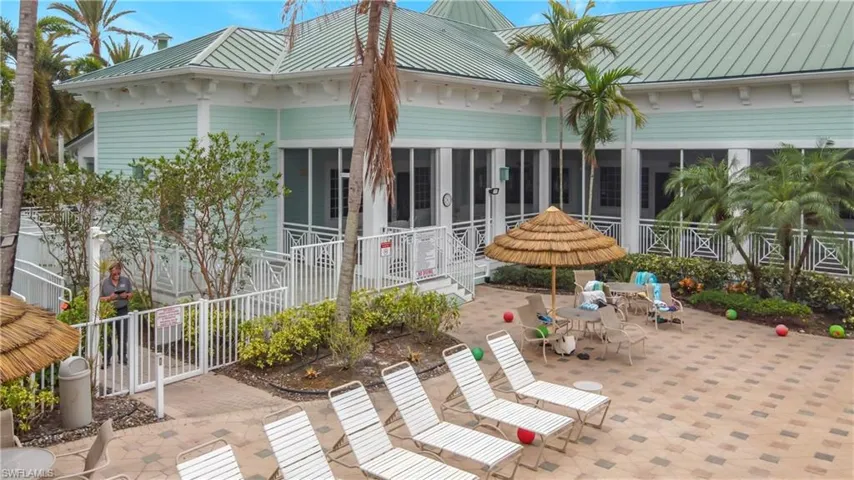 View of patio featuring a sunroom