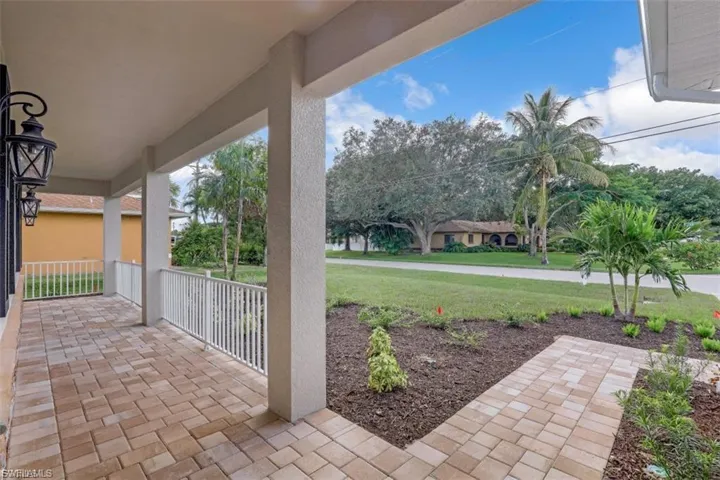 Covered porch with a yard