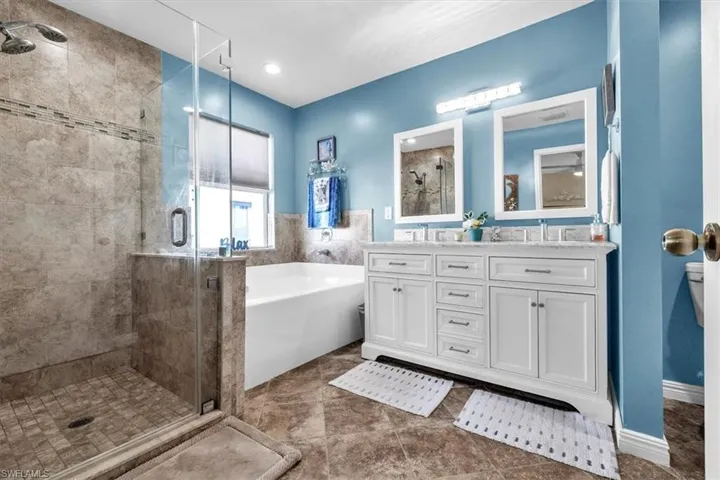 Double vanity with undermount sinks and individual mirrors