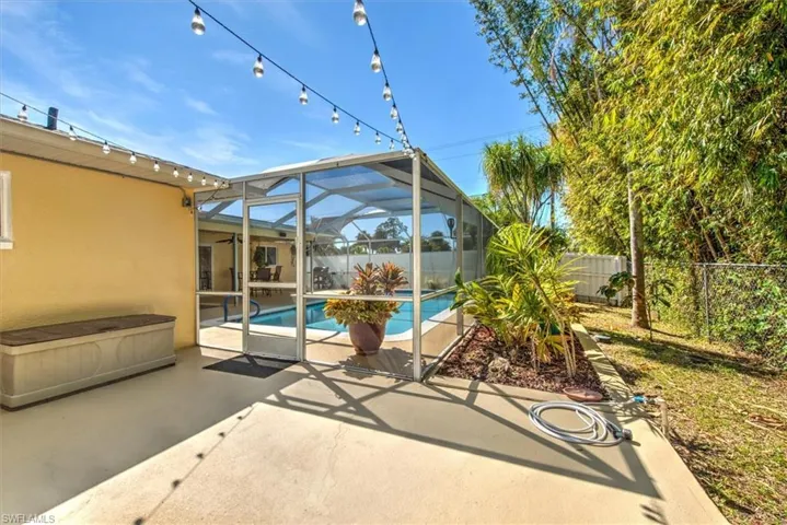 View of patio / terrace with a fenced in pool, a fenced backyard, and a lanai