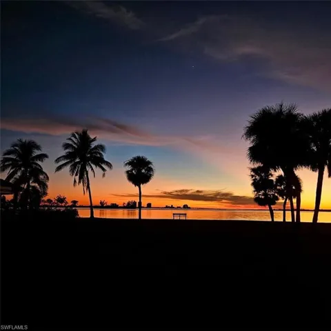 Nature at dusk featuring a water view