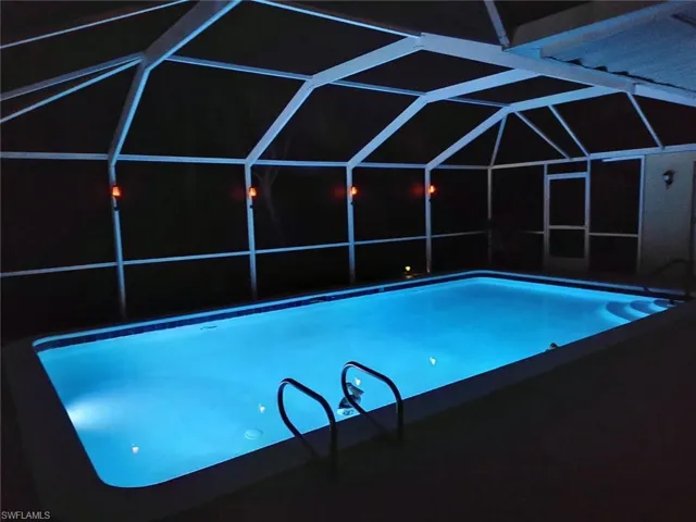Outdoor pool with screened enclosure