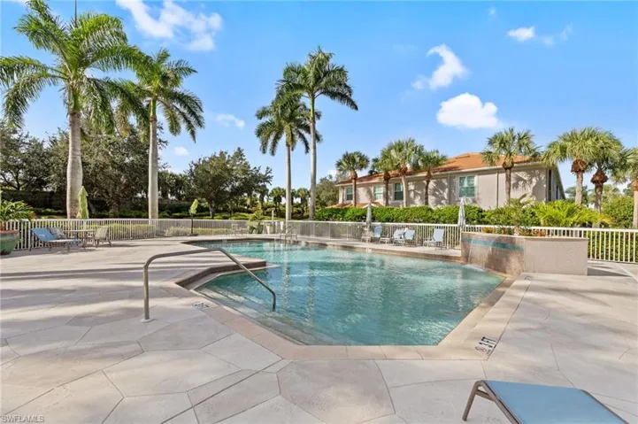 Community pool featuring a patio area
