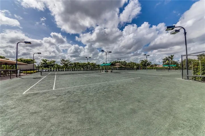View of tennis court with community basketball court