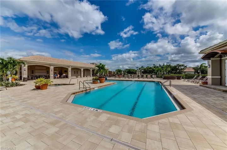 Community pool with a patio