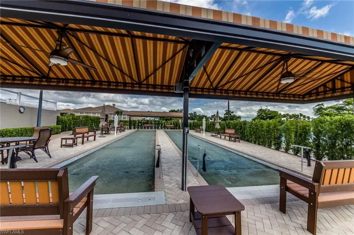 View of pool featuring a bocce ball area and a patio area
