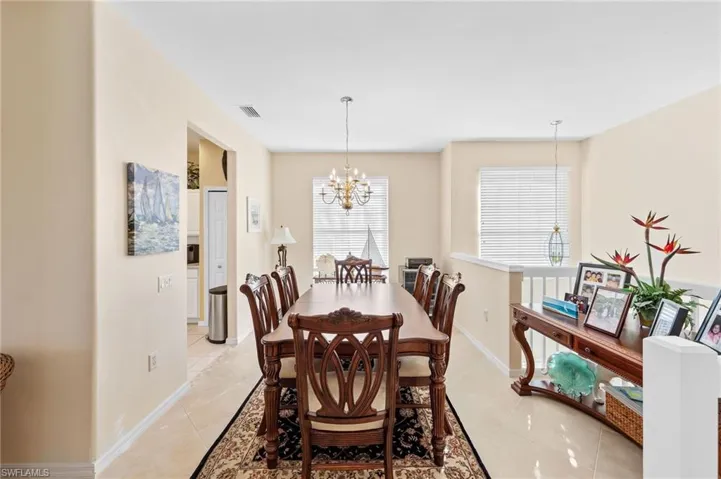 Dining space featuring a chandelier and light tile patterned flooring