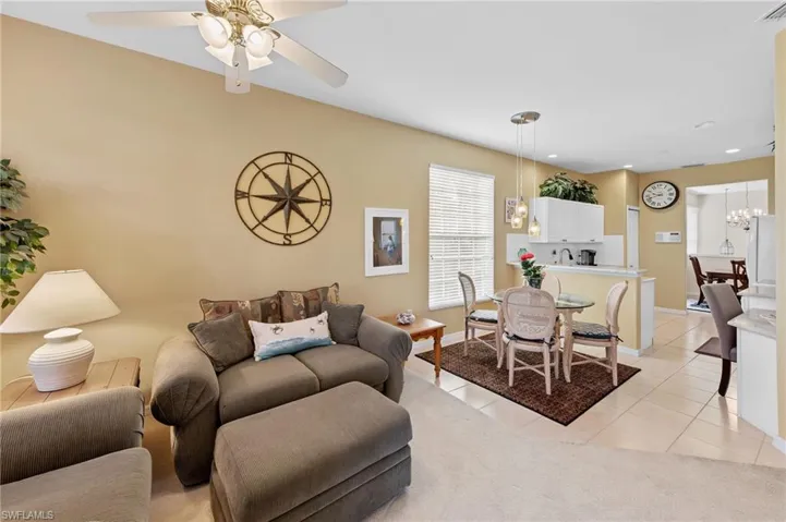 Living area featuring light tile patterned flooring and recessed lighting