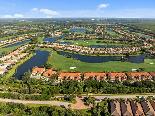 Aerial view of property's location featuring nearby suburban area and a golf club