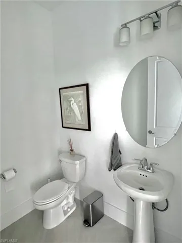 Bathroom featuring toilet and tile patterned floors