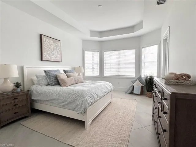 Bedroom with light tile patterned floors