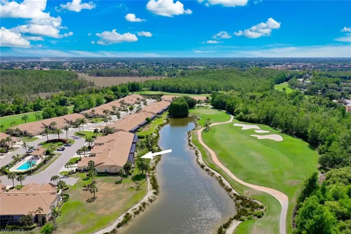 Bird's eye view of a large body of water and a local golf course