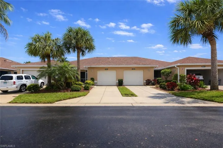 Ranch-style house with stucco siding, driveway, and a garage