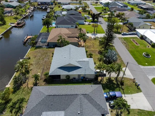Aerial perspective of suburban area with a large body of water