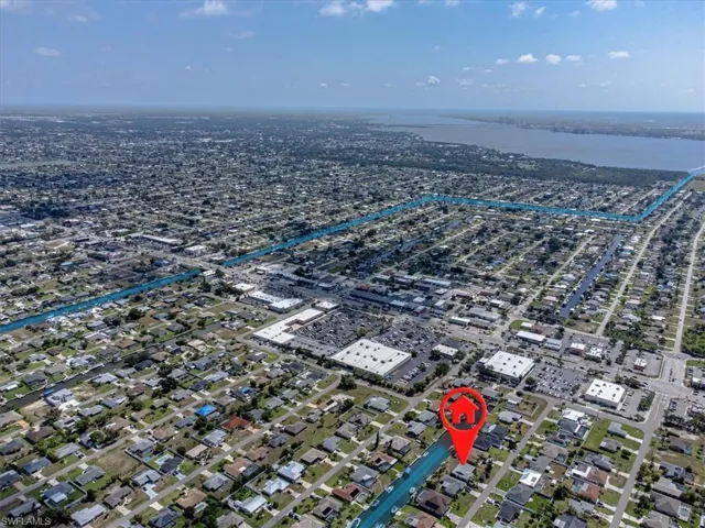 Aerial overview of property's location with a nearby body of water