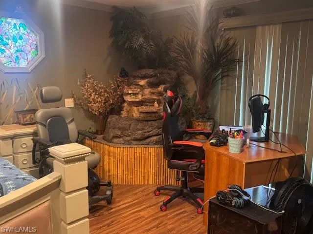 Office area featuring wood finished floors