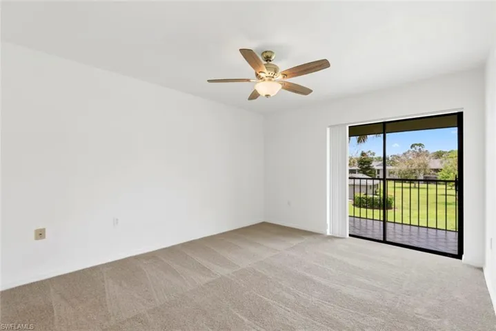 Access your wide lanai from the primary bedroom