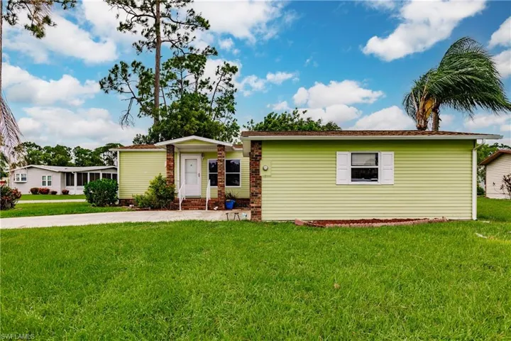 View of front of property with a front yard