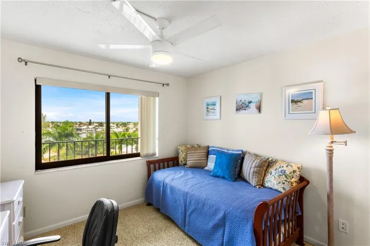 Guest bedroom with day bed and also water and lush tropical views!