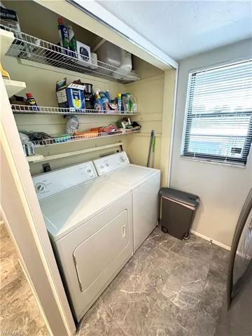 Indoor laundry conveniently located next to kitchen.