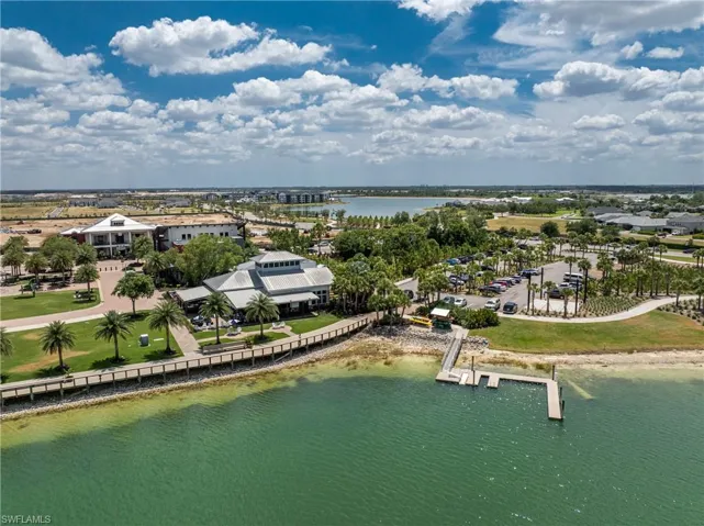 Birds eye view of property with a water view