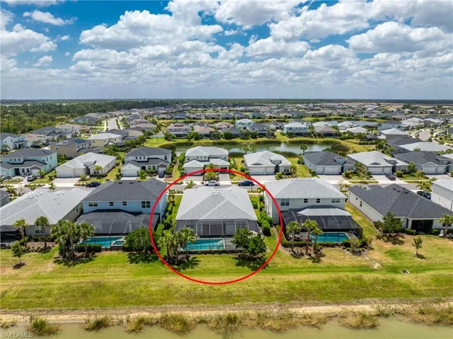 Drone / aerial view featuring a water view and a residential view