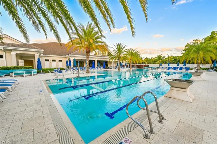 Community pool with a patio