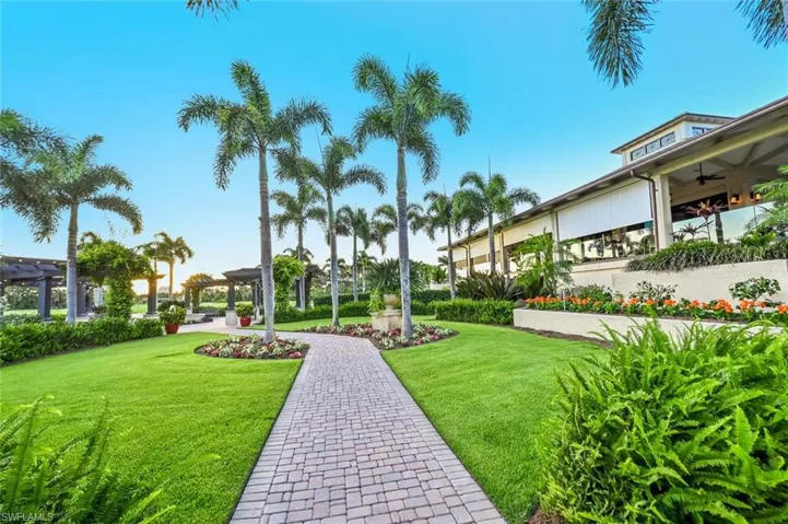 View of property's community featuring a yard