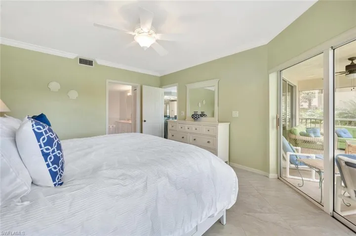 Bedroom featuring access to outside, crown molding, ceiling fan, and connected bathroom