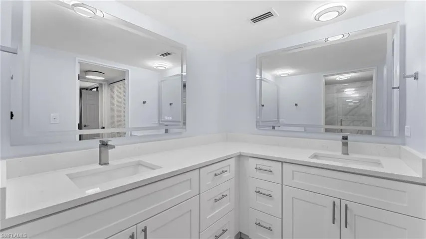 Bathroom featuring double vanity