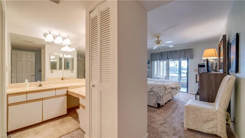 Bathroom featuring vanity and ceiling fan