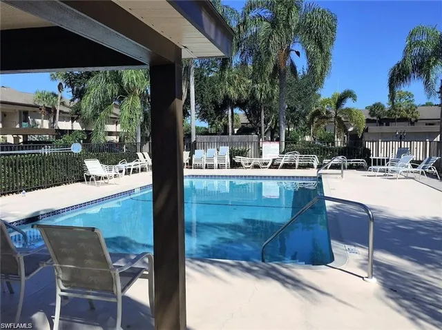 View of swimming pool with a patio area