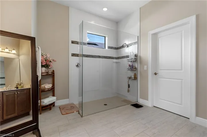 Bathroom with a walk in shower and vanity