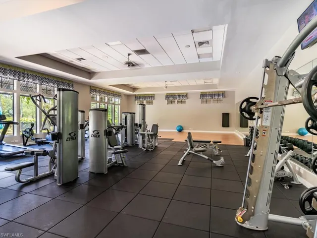 Gym featuring a tray ceiling