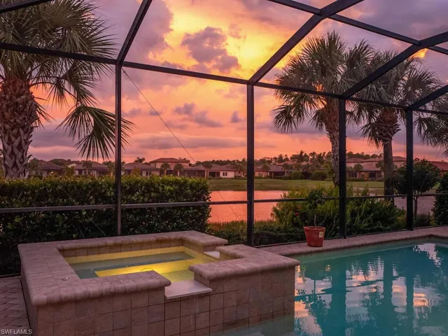 Pool at dusk with glass enclosure