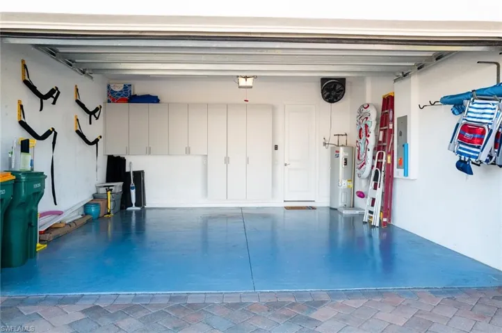 Garage with a garage door opener and water heater