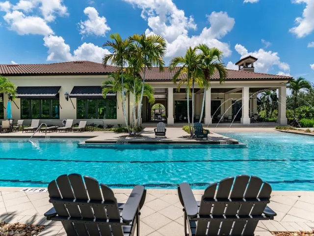 View of pool with a patio and pool water feature