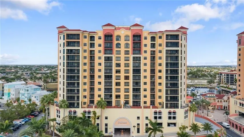 View of apartment building / complex featuring a water view