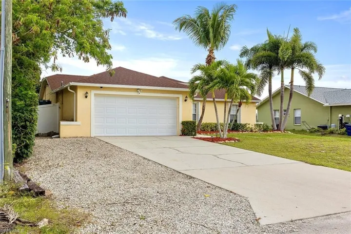 Two Car Garage & 2 Paved + 1 Unpaved Driveway