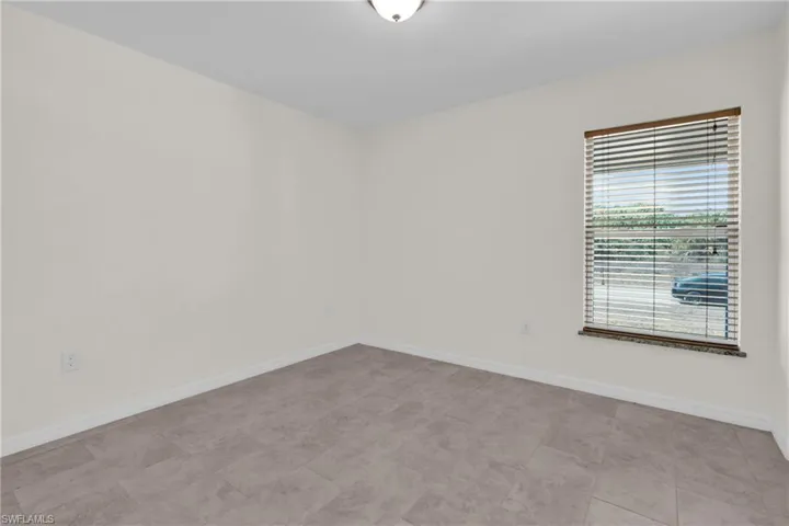 Bedroom featuring baseboards and a closet