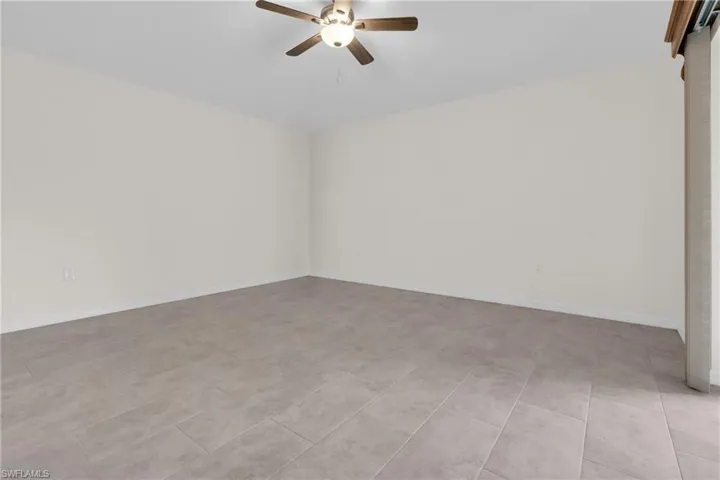 Master bedroom featuring ceiling fan and baseboards