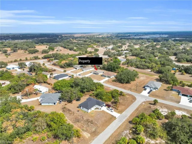 Aerial overview of property's location featuring nearby suburban area