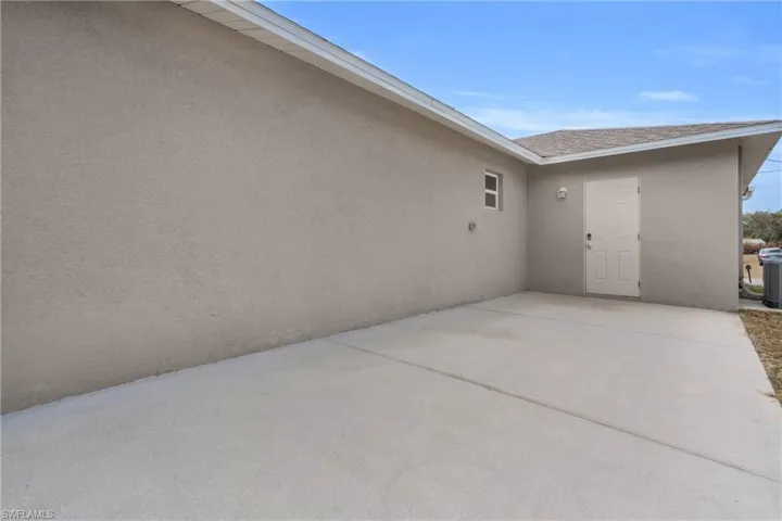 View of home's exterior with a patio area and stucco siding