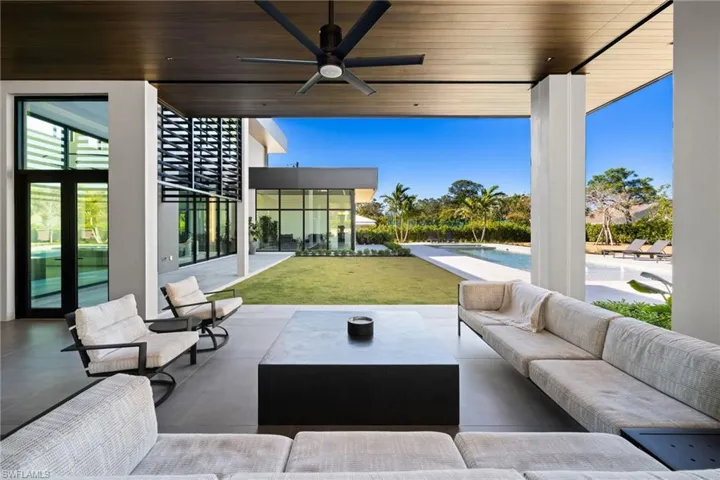 View of patio featuring an outdoor living space and ceiling fan